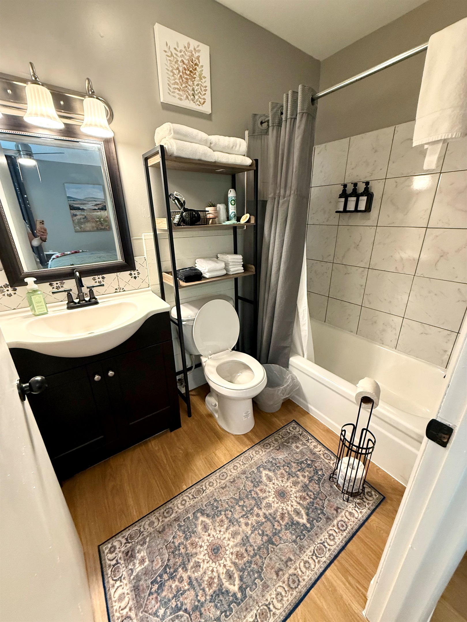 Full bathroom with tub/shower combo.