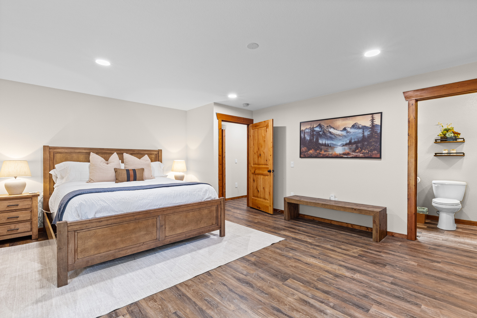 Primary Bedroom with California King Bed, nightstands and closet