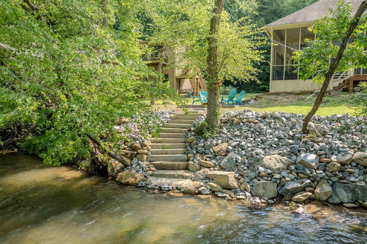 NEW stone stairway leading you right down to the river’s edge, where you can soak up the sights and sounds of the water. The perfect spot for fishing, wading, or simply enjoying the beauty of nature just steps from your door.