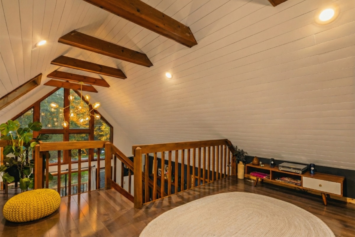 Upstairs loft area - open to below, but perfect for Yoga, listening to records, hanging out, or additional sleeping w/private bathroom and shower