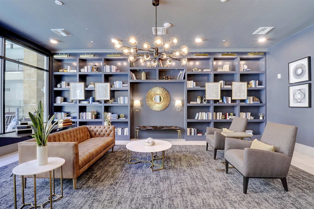 - Stylish library lounge featuring bookshelves, cozy seating, and warm tones   - Great for reading, casual chats, or working in a peaceful setting   - Elegant lighting and decor add sophistication to your stay experience