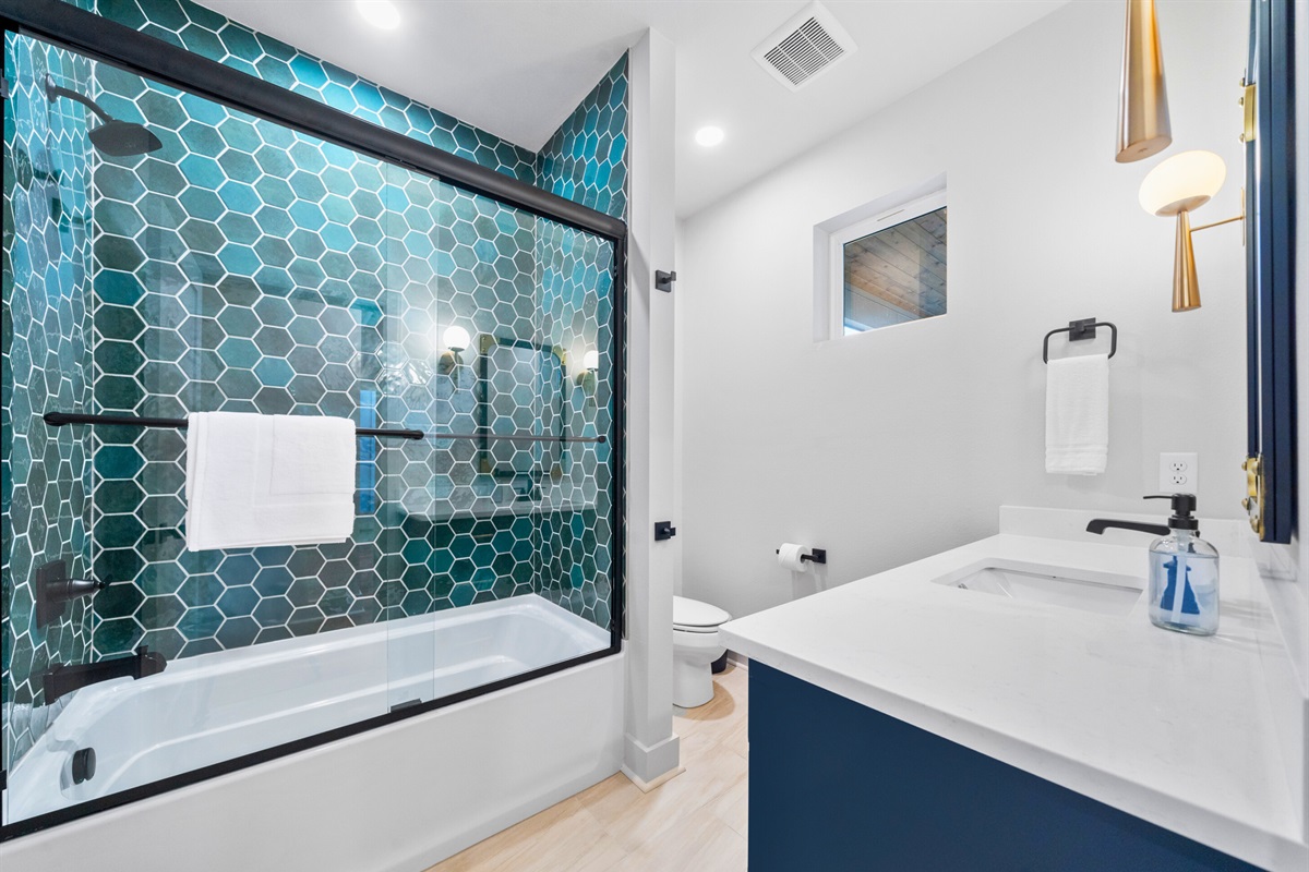 Sleek and functional, this modern bathroom has everything you need to start your day refreshed and ready for adventure.