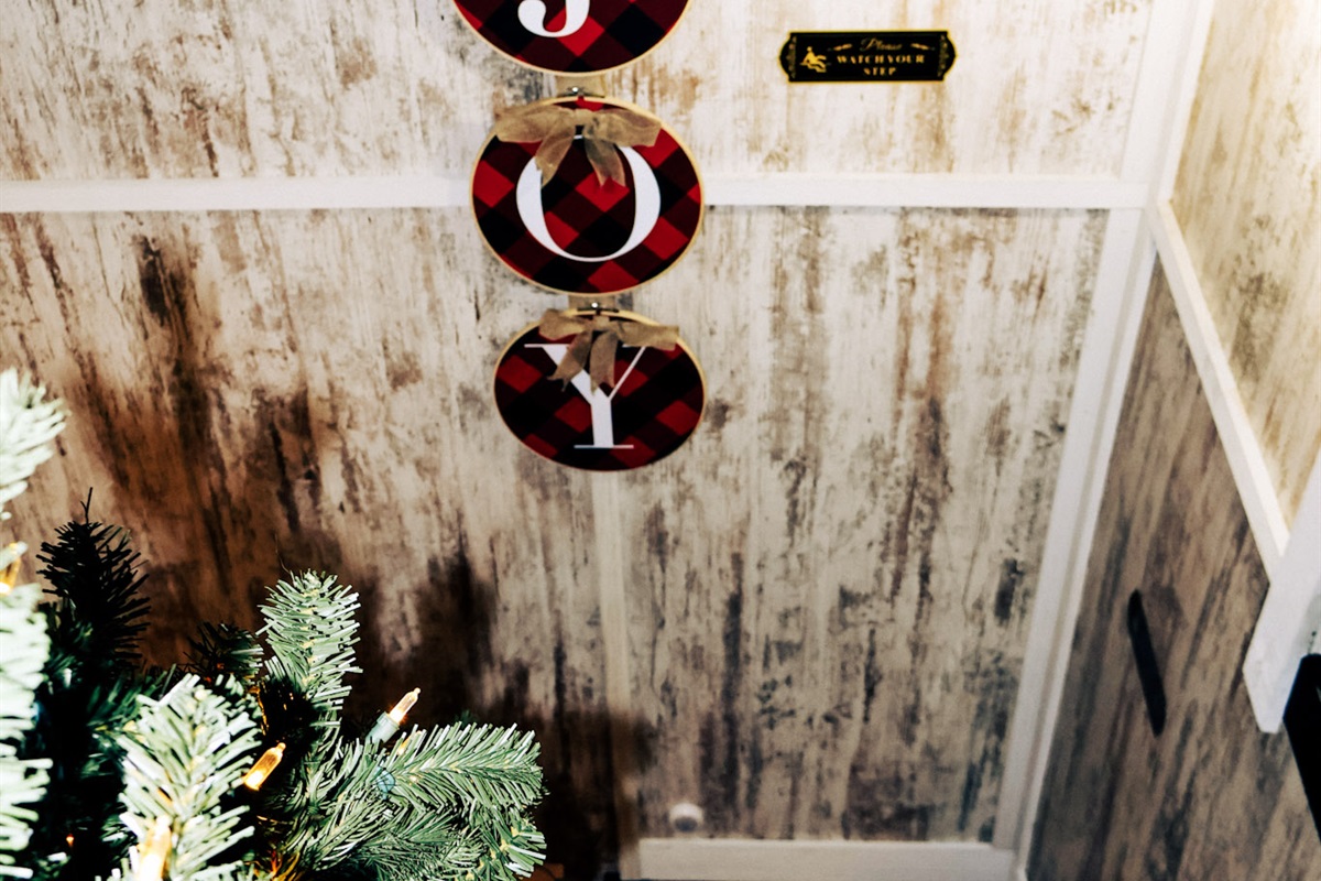 The stairs down from the bedroom loft