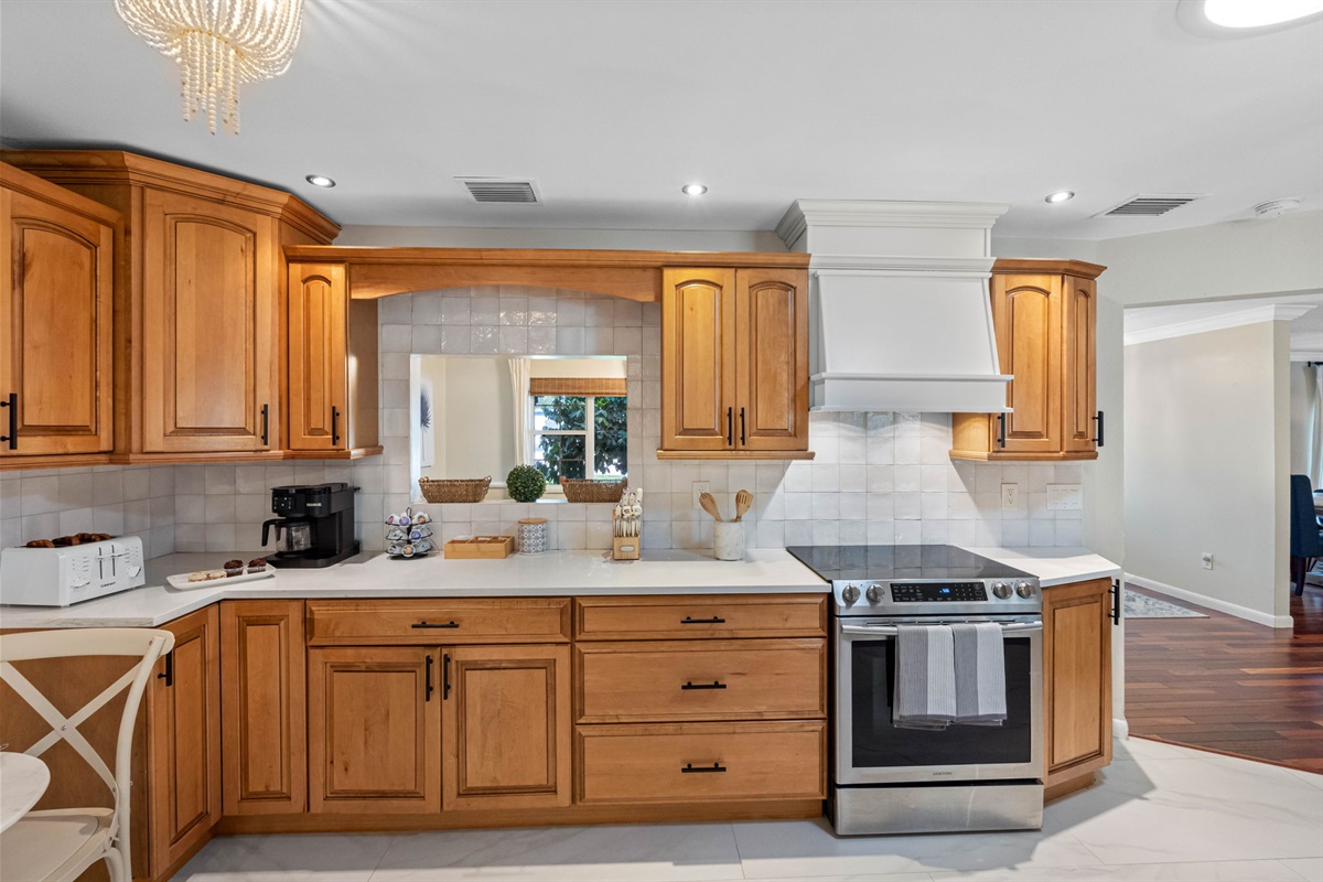 This well-appointed kitchen is both functional and stylish, offering a balance of classic and contemporary design.