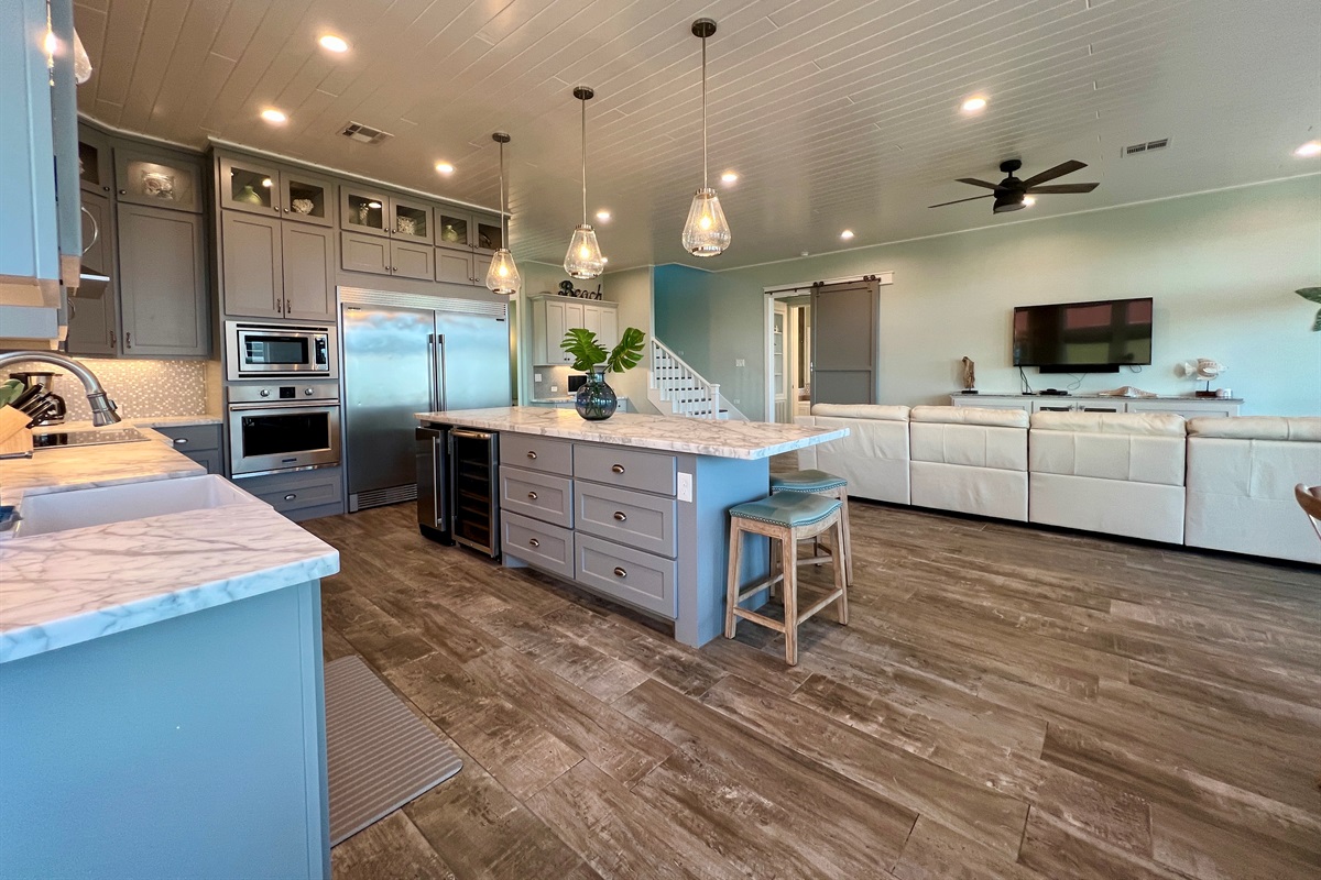 Crystal Paradise Kitchen: Bright, open kitchen featuring luxurious marble surfaces and generous space for gatherings.