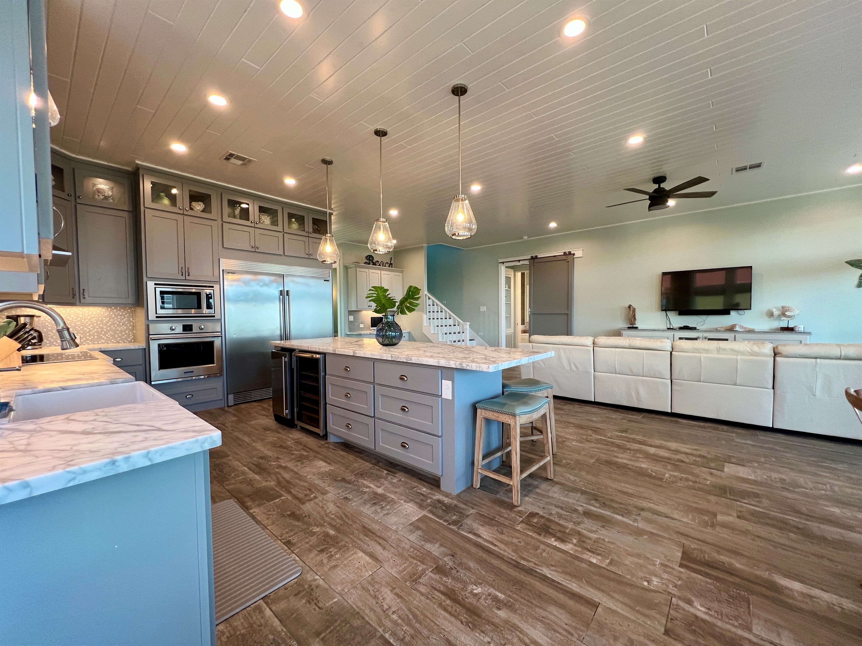 Crystal Paradise Kitchen: Bright, open kitchen featuring luxurious marble surfaces and generous space for gatherings.