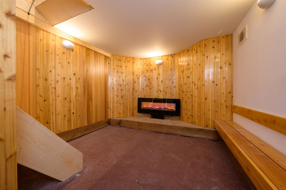 Basement Drying Room includes Fireplace, Dehumidifier and 10 Boot Dryer.   
* Wall on the right now includes slat board with hooks & wire shelves for hanging wet gear.   