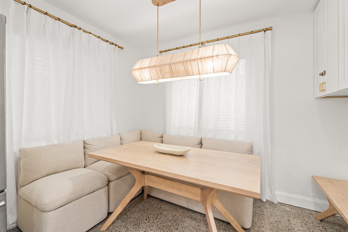 Cozy built in dining nook made for coffee chats and late night wine.