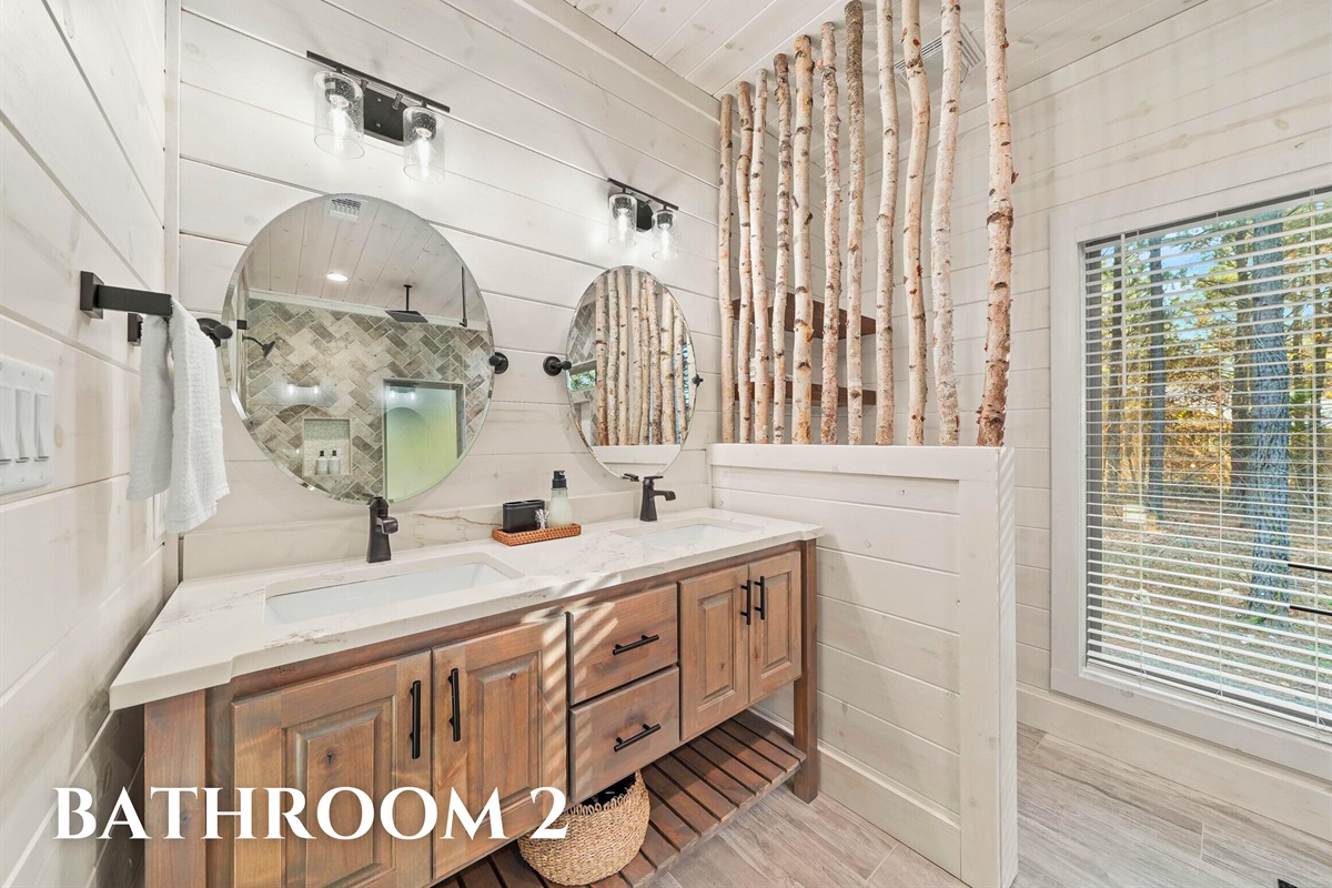 Bathroom 2 with spacious vanity and farmhouse charm.