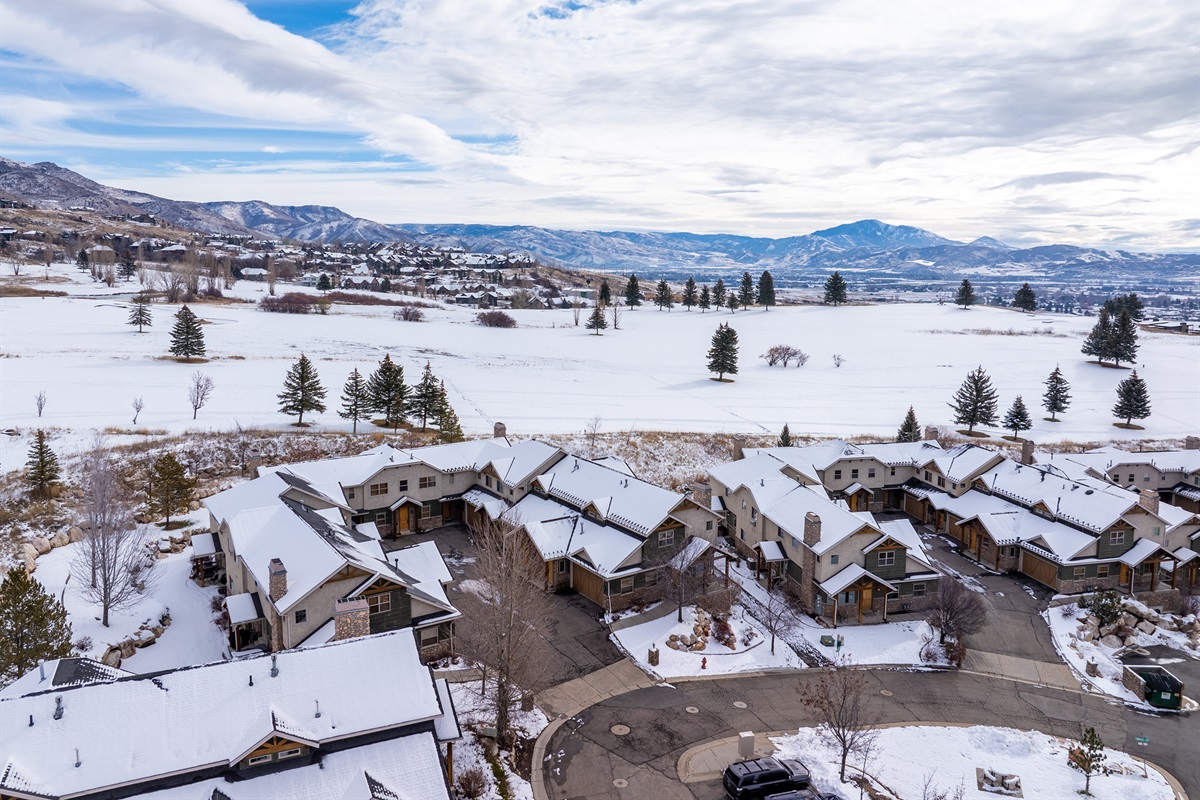 Snow-covered Cascades neighborhood with scenic mountain backdrop