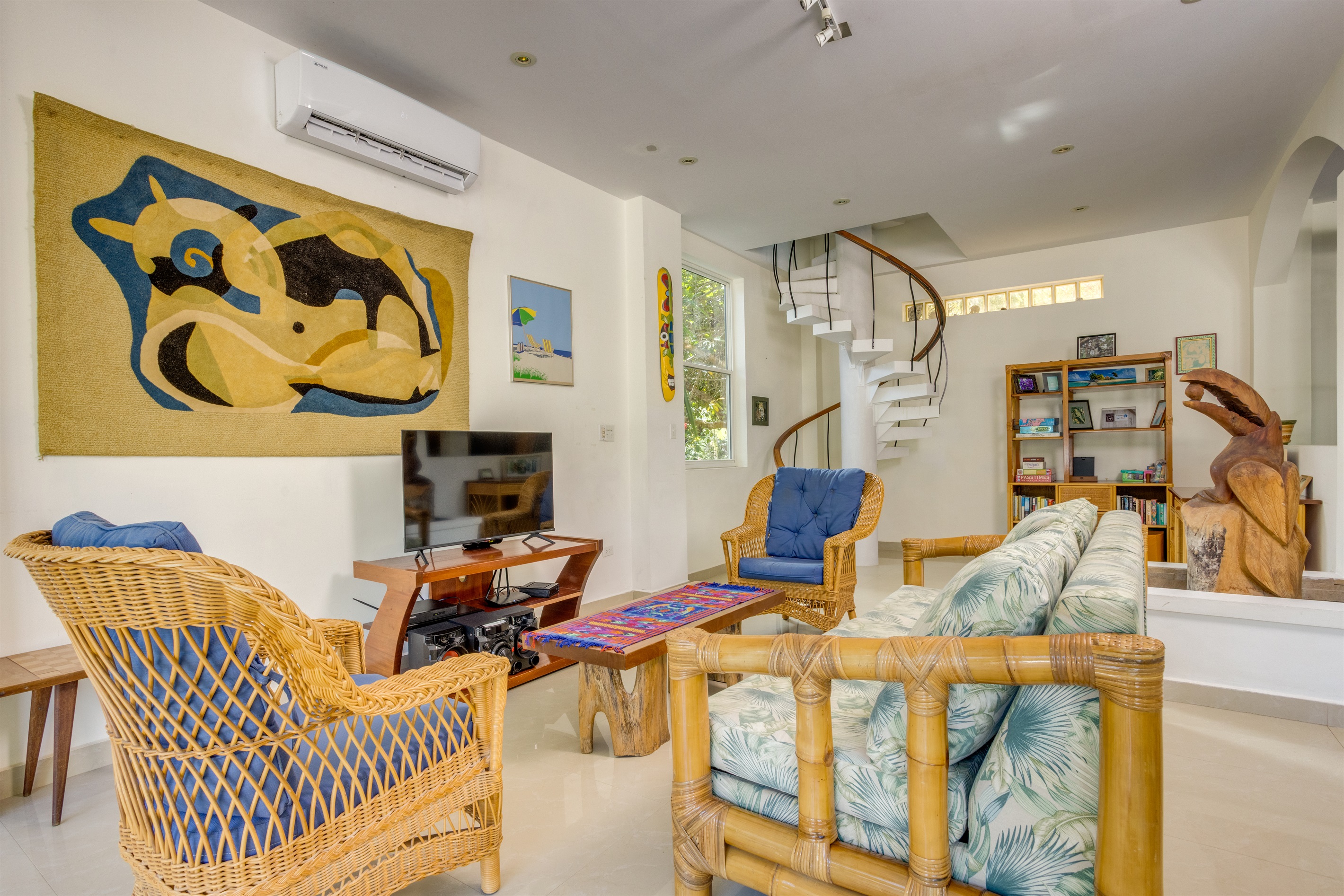 Living room with office space and spiral staircase