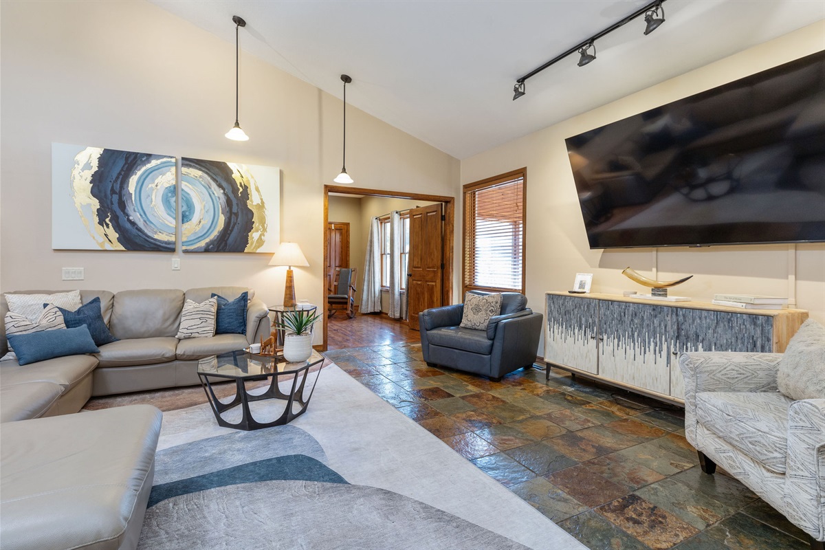 Upper level living room with huge TV to watch movies with the family!