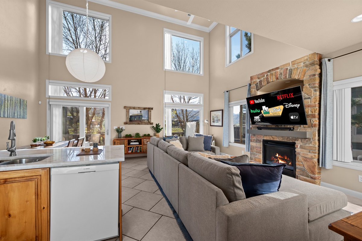 Open-concept great room designed for gathering, relaxing, and taking in the natural light.
