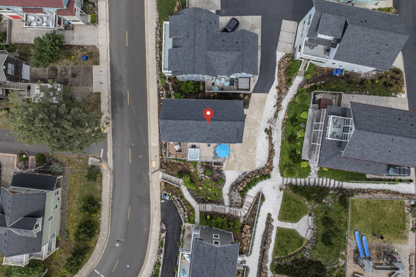 Aerial view showing the driveway, parking area, and home location to make arrival easy.