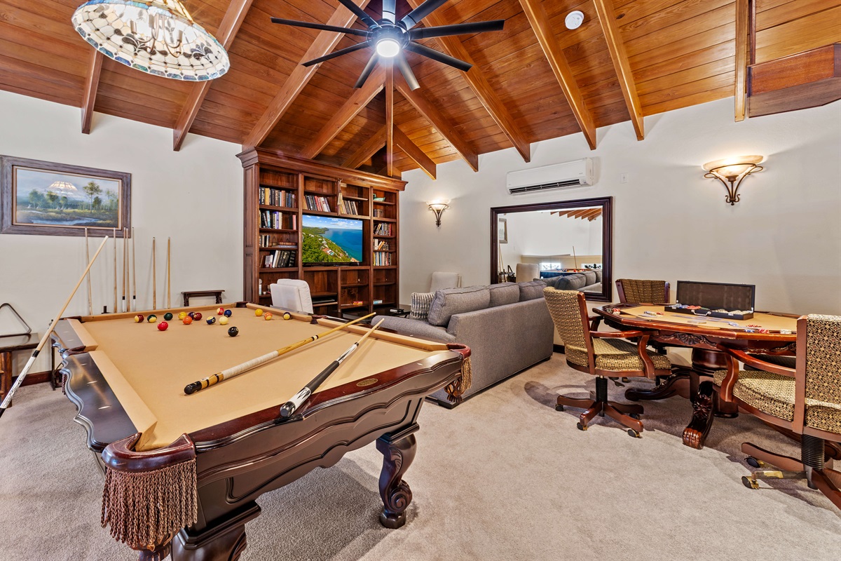In the game room we have a pool table, poker table, a marble chess table, and queen sleeper sofa.