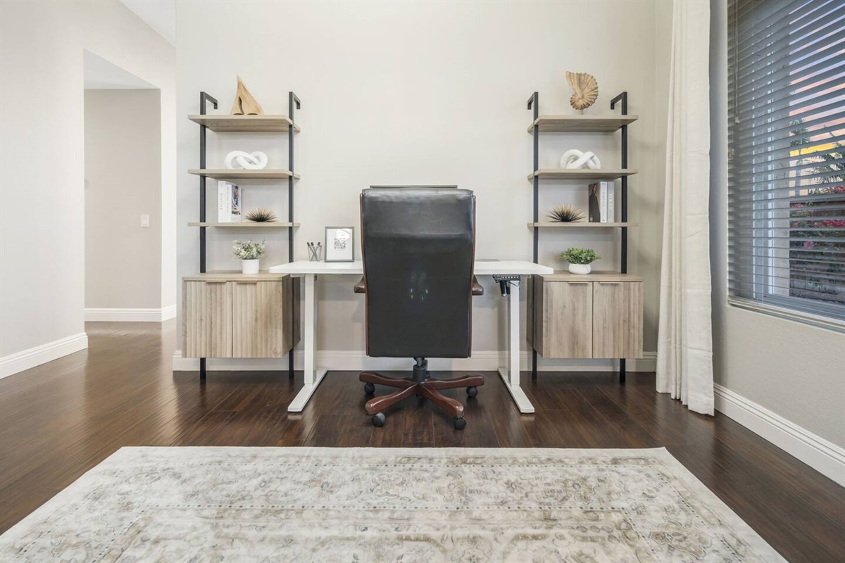 The workspace includes a 60" standing desk for versatility, a laptop monitor for dual-screen efficiency, and an ergonomic office chair for comfort. High-speed internet ensures seamless connectivity, making it perfect for working remotely.