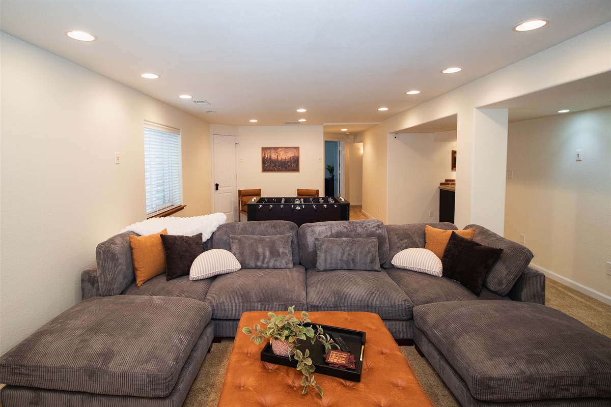 Theater lighting, comfortable seating, huge TV, and foosball!