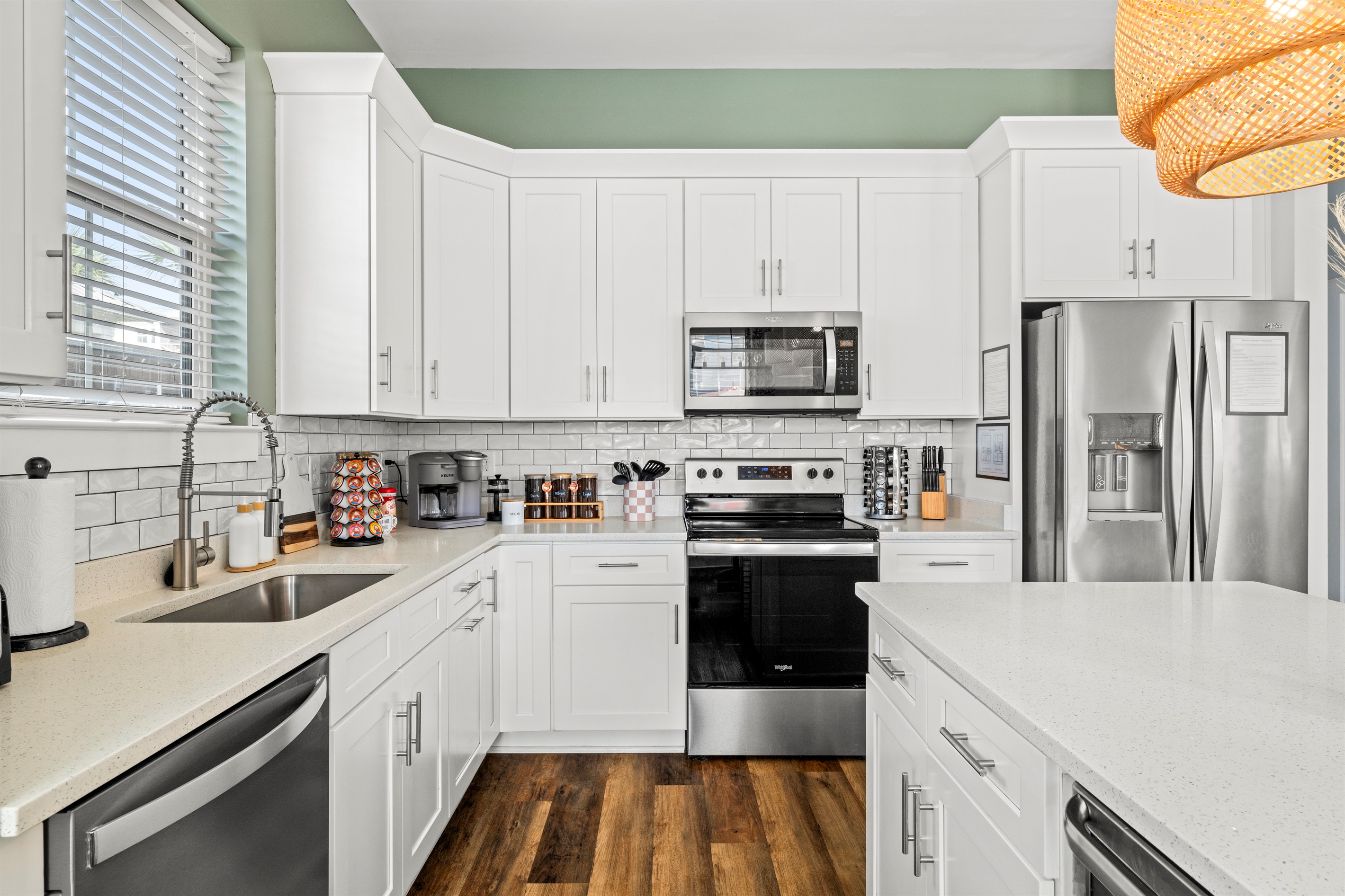 A bright, fully stocked kitchen ready for vacation meals. Stainless appliances, plenty of counter space, and everything you need after a long day at Miramar Beach.