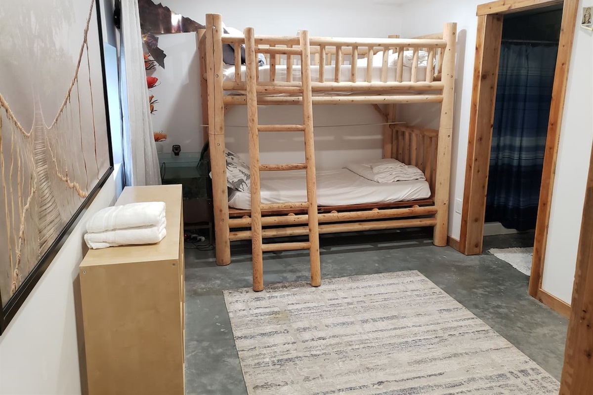 Bedroom 7 in basement with ensuite bathroom. 