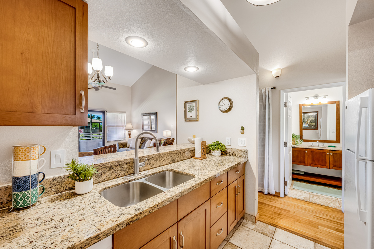 A cheerful kitchen stocked with a collection of quirky coffee mugs.