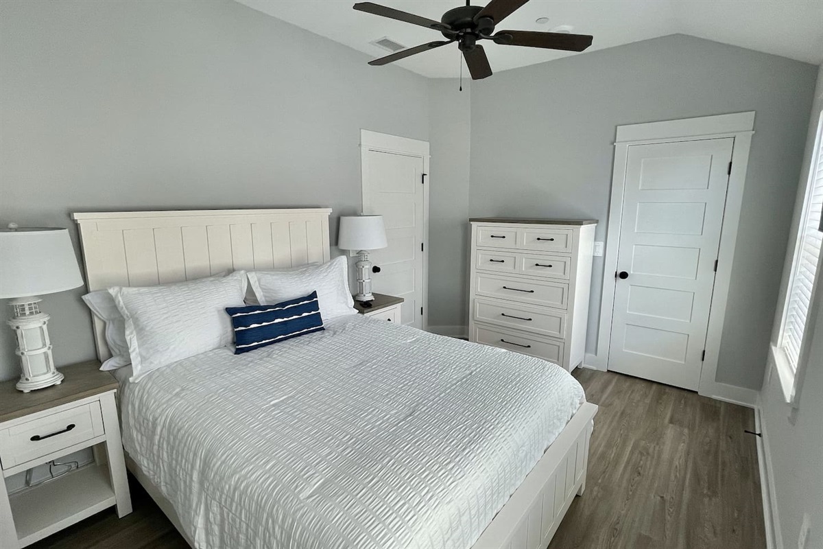 Bright, airy, and inviting. This Queen suite offers a cozy, premium atmosphere with ample storage and easy access to its own private bathroom