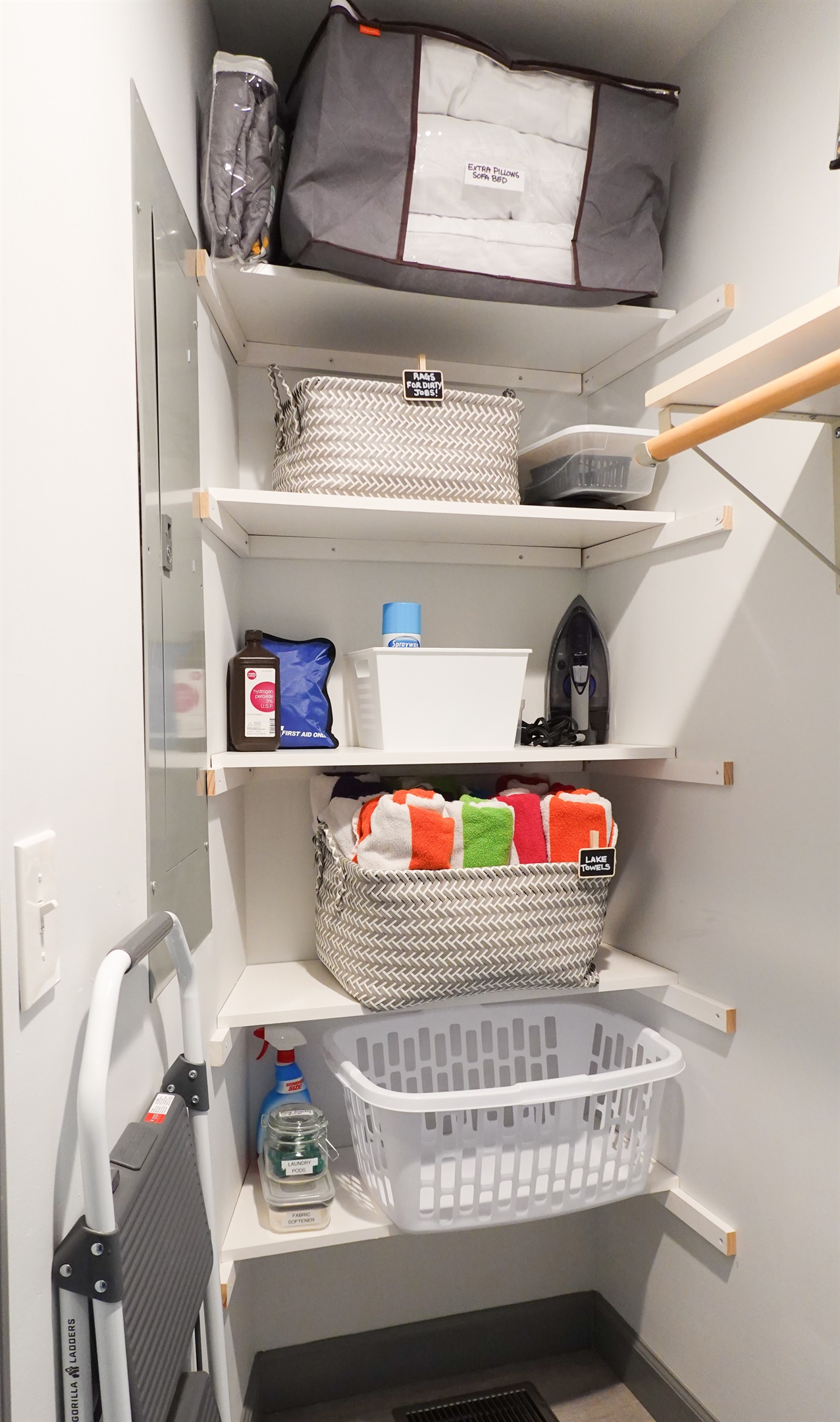Well-equipped laundry room, featuring complimentary detergent, fabric softener, lake towels, and other thoughtful extras.