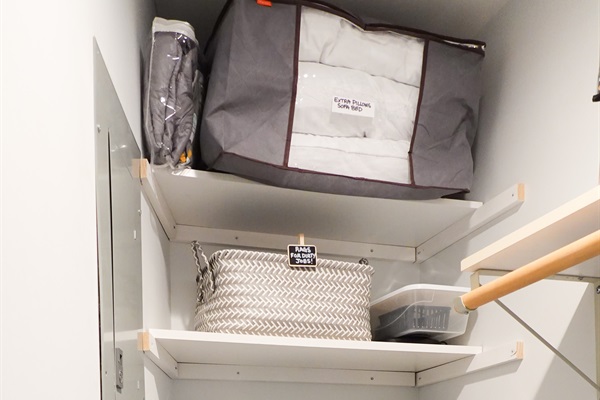 Well-equipped laundry room, featuring complimentary detergent, fabric softener, lake towels, and other thoughtful extras.