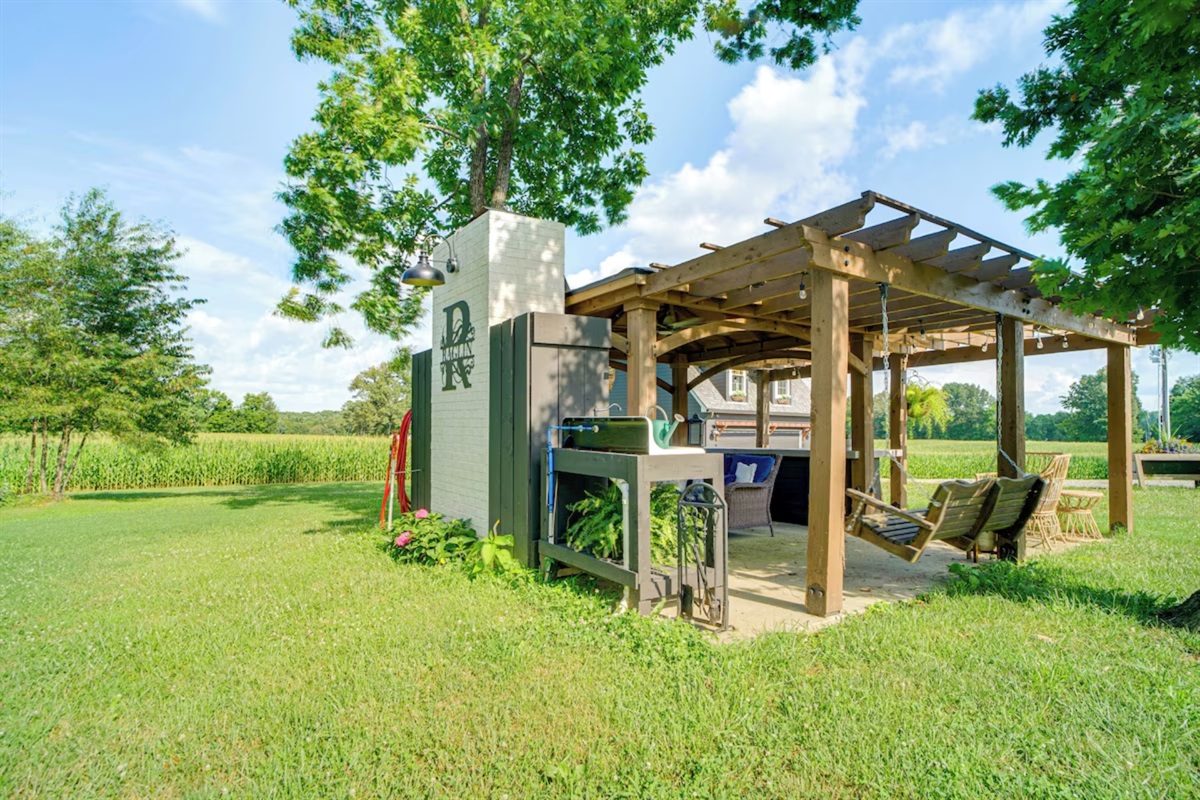 Outdoor covered kitchen with smart TV