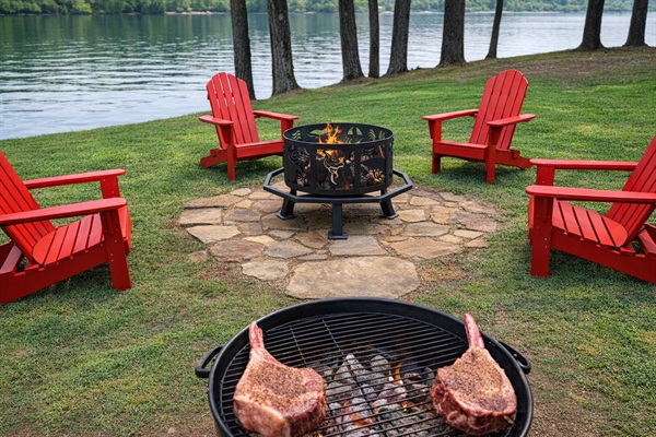 Lakeside firepit with seating for the whole group — perfect for sunset grilling & s’mores.