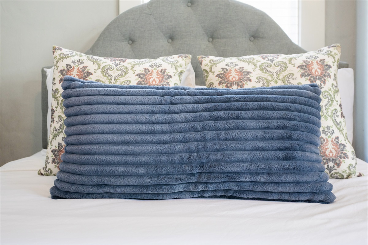 Sink into plush pillows for a restful night and cozy comfort.
