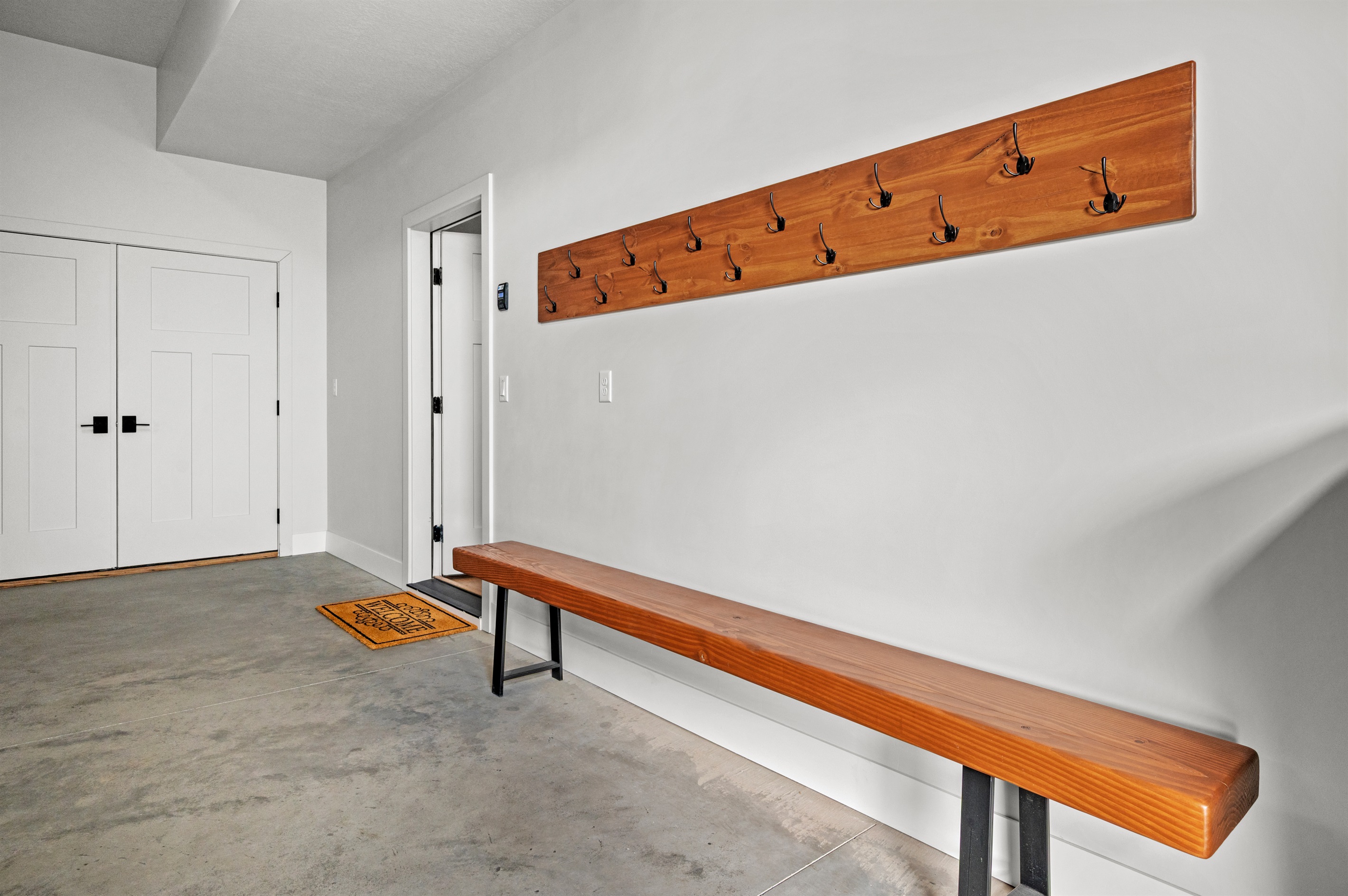 two-car garage features storage for 10–12 skis or snowboards plus a private tuning station to keep your gear in top shape
