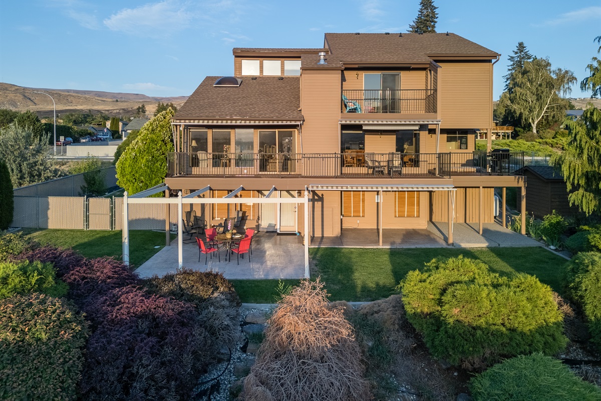 Stunning river-view home with expansive outdoor living space.