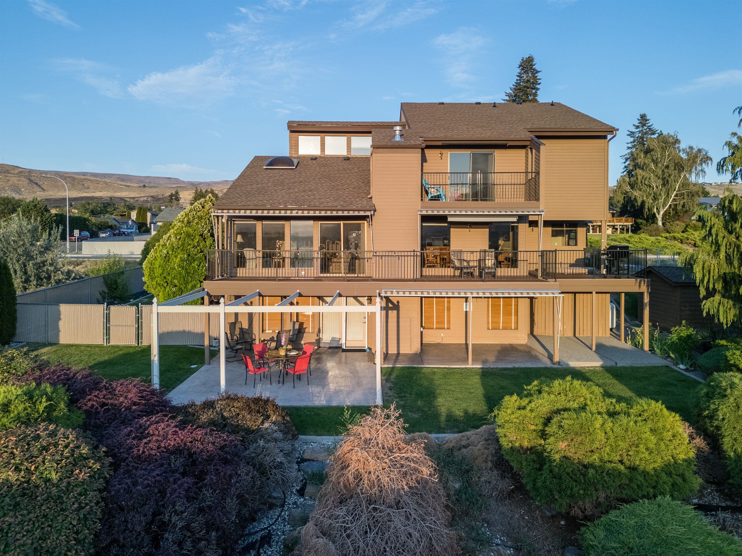 Stunning river-view home with expansive outdoor living space.