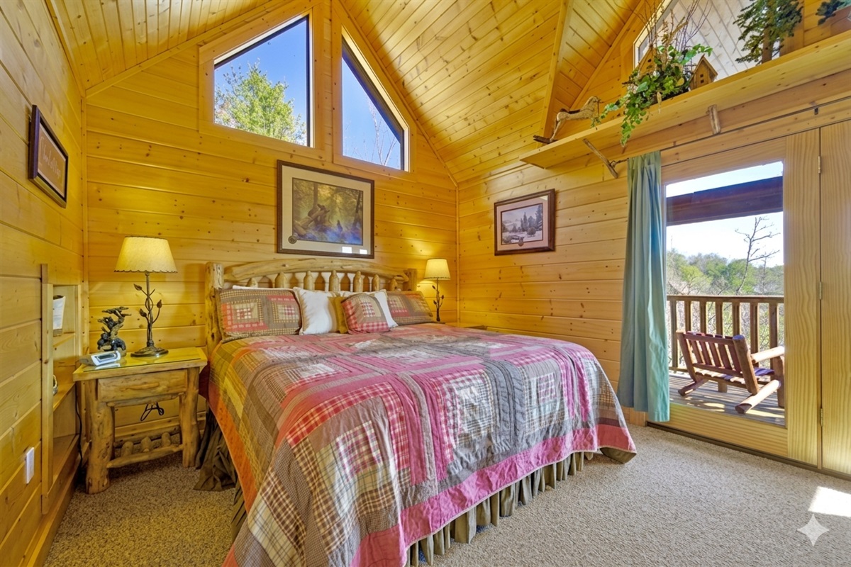 Bedroom #2 - Wake up to sunlight streaming through tall windows and step out to your private balcony for morning coffee with a mountain breeze. A peaceful hideaway that feels like your own secret nook in the Smokies.