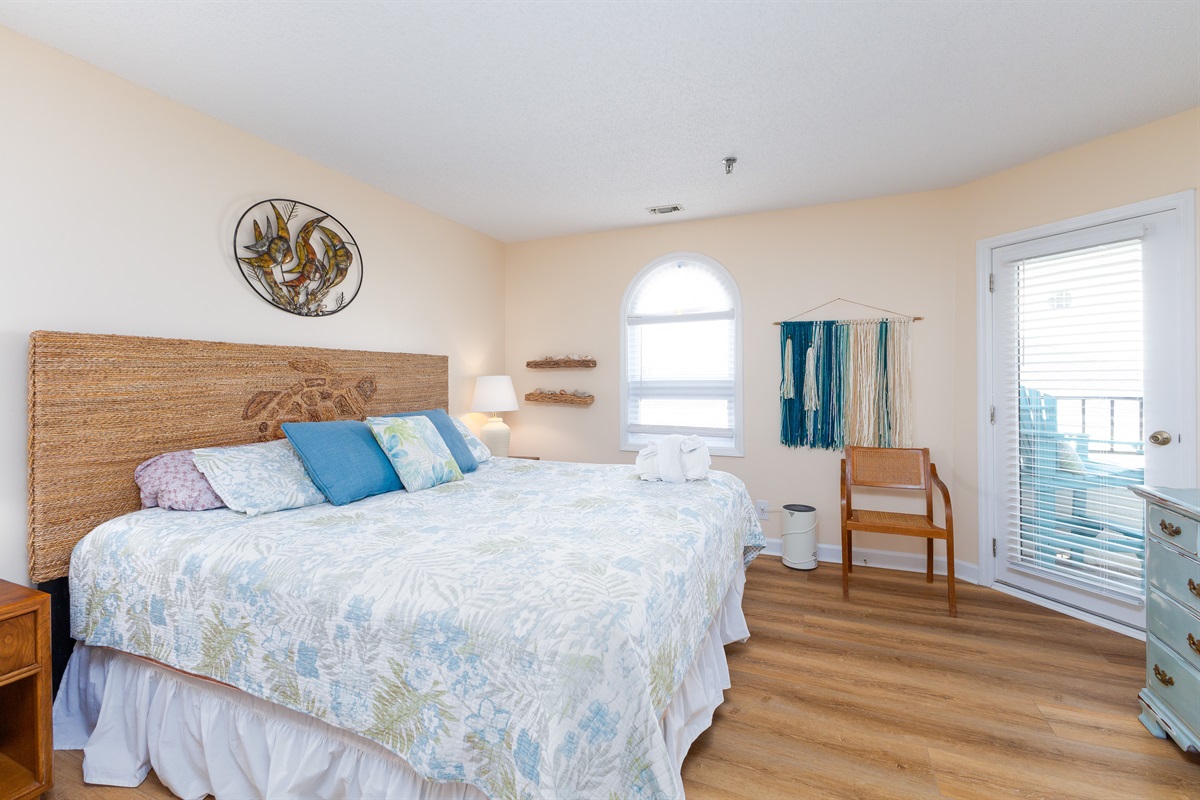 Wake up to ocean breezes and sun-drenched mornings in this cozy master bedroom