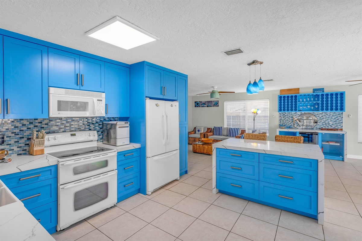 Along with a kitchen island with barstools to accomodate two more.