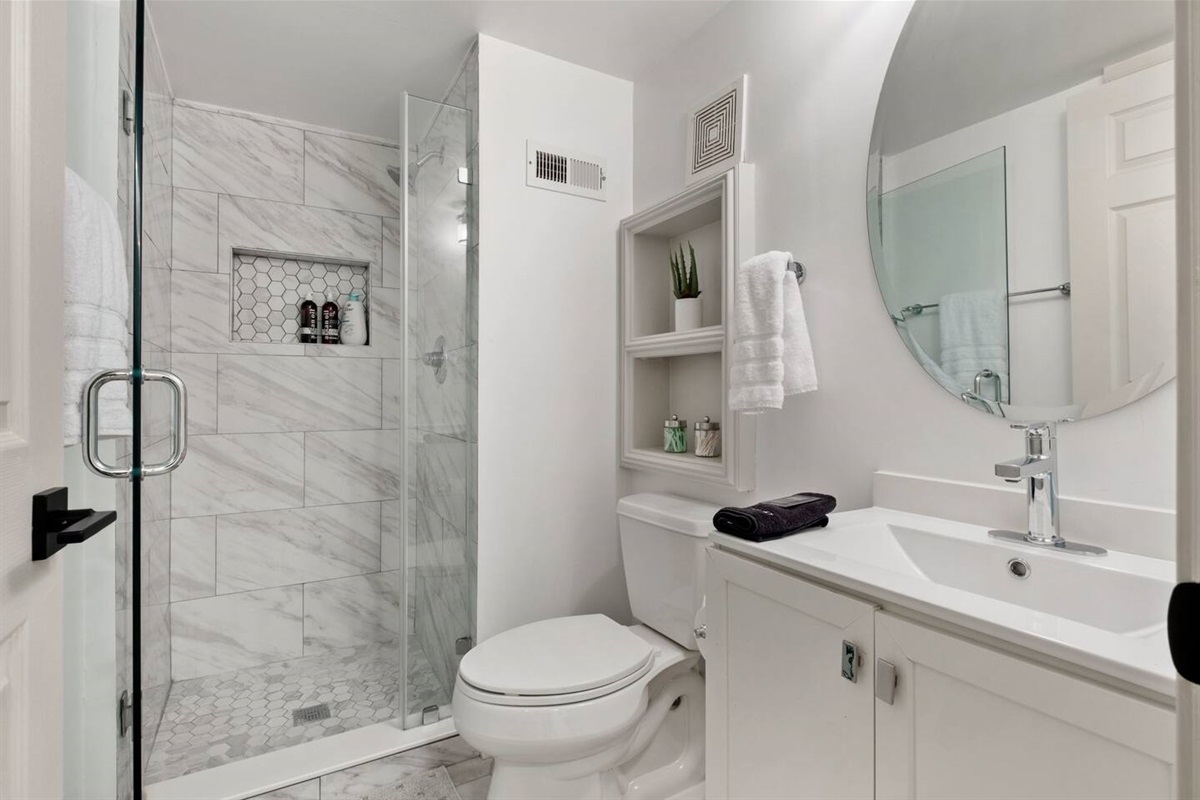 Modern, crisp, newly renovated bathroom. 