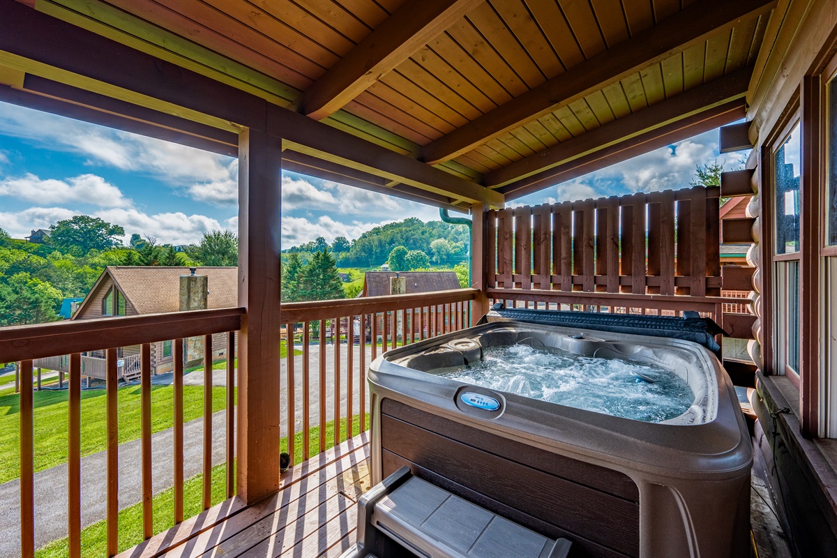 Relax and recharge in the hot tub with mountain views