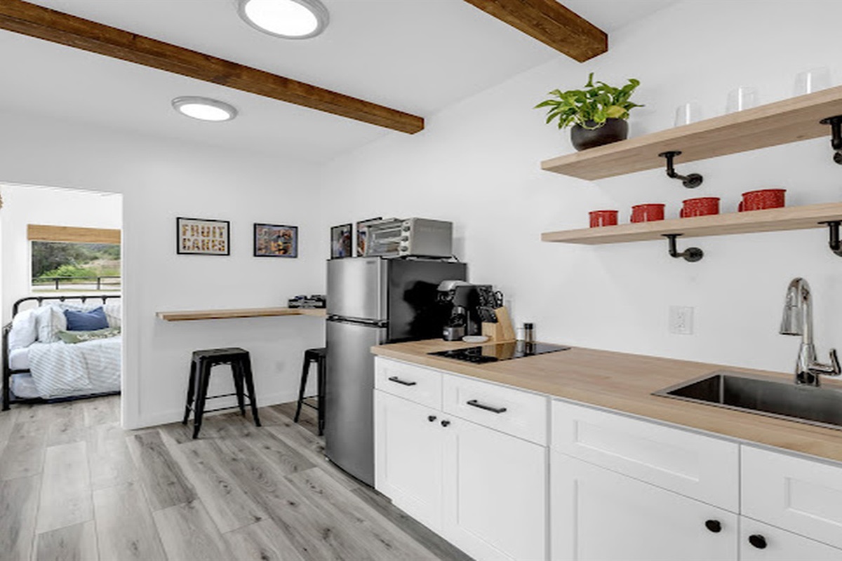 Thoughtfully designed kitchenette with modern comforts and charm.
