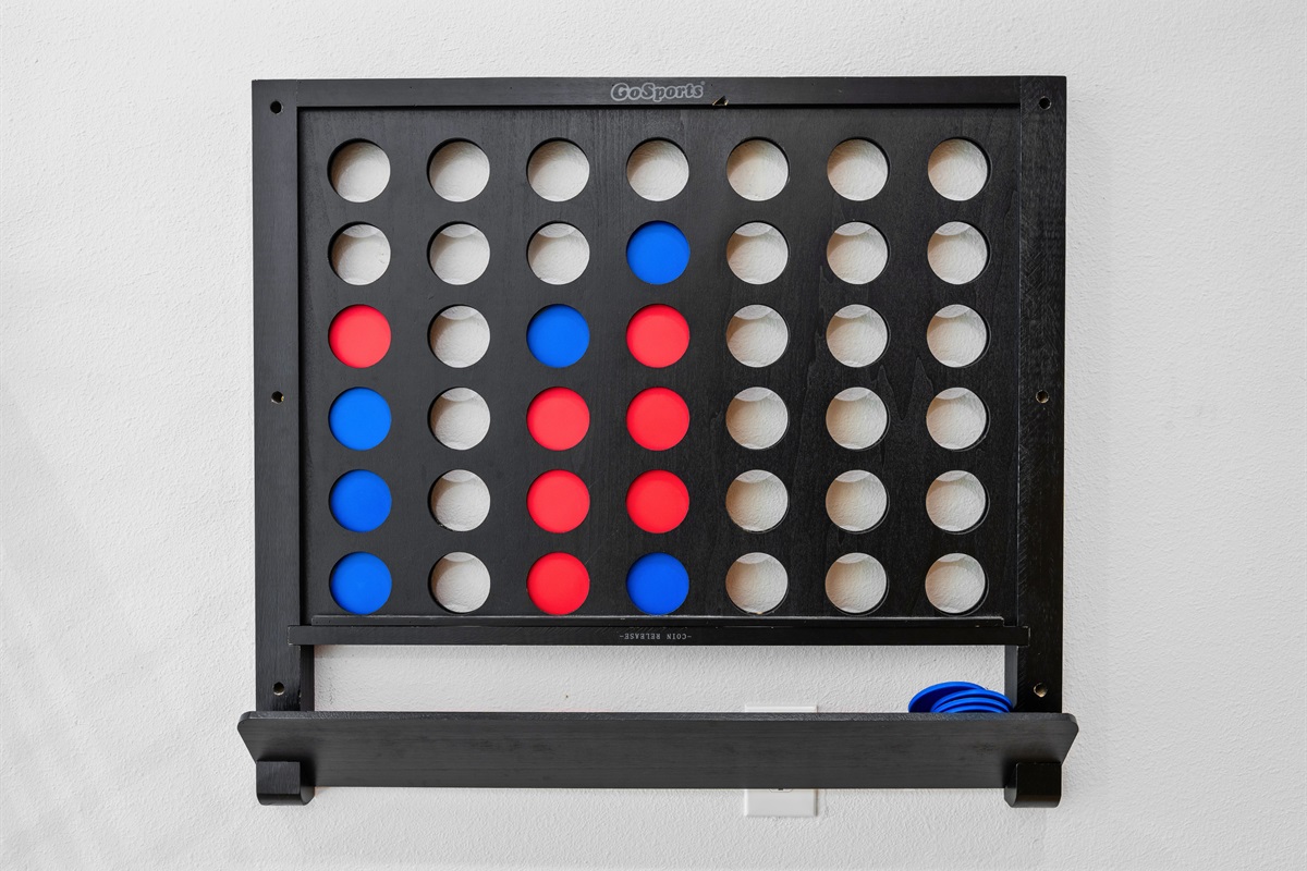 A game setup in the loft adds a fun, casual element that guests of all ages can enjoy.