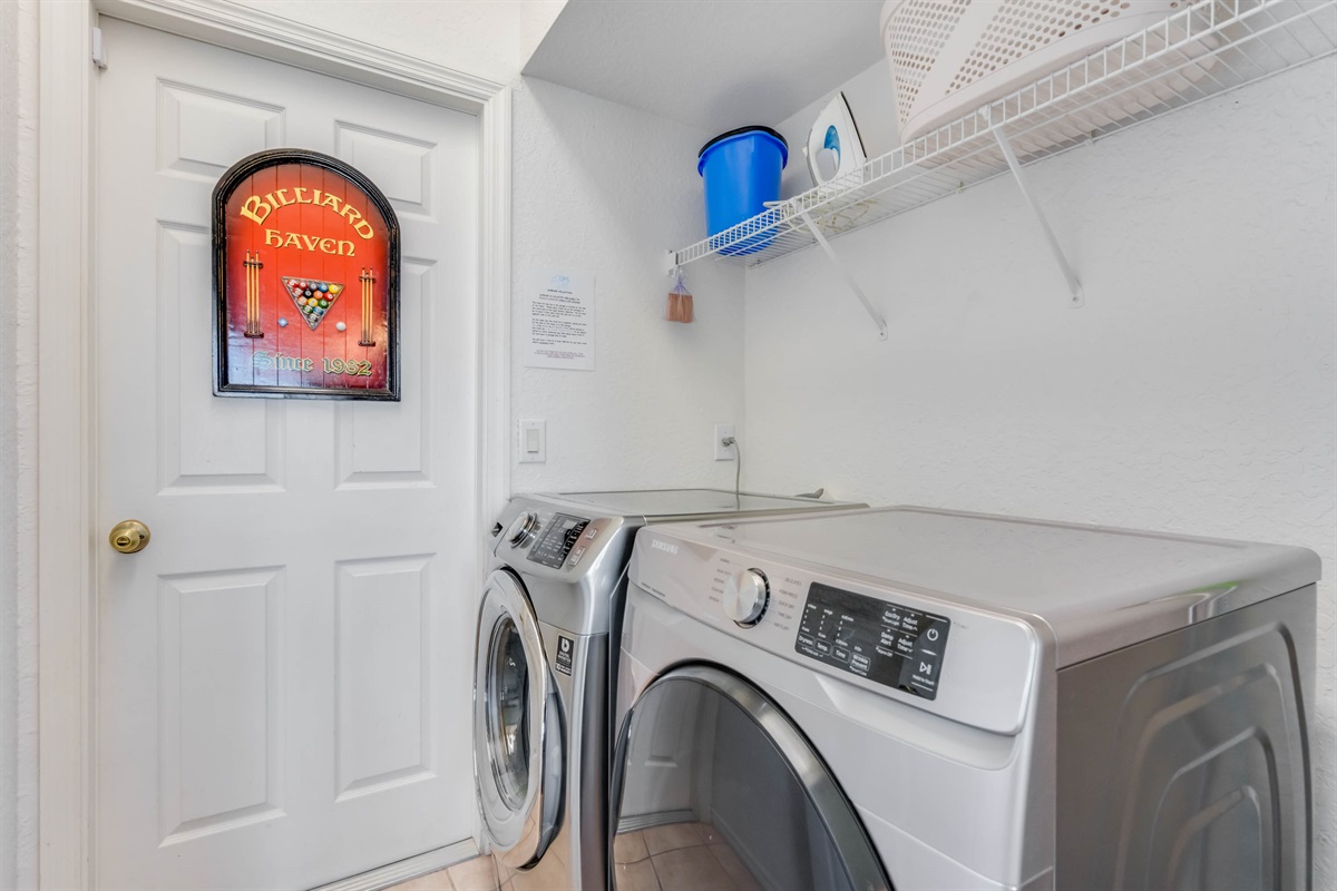 The laundry area features front loader washer and dryer free for guests to use.