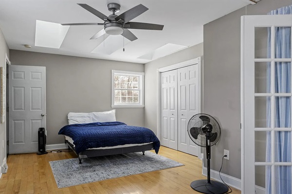 This versatile office-bedroom combo offers a double bed, spacious closet, desk + chair, and convenient location near the bunk room for added flexibility.
