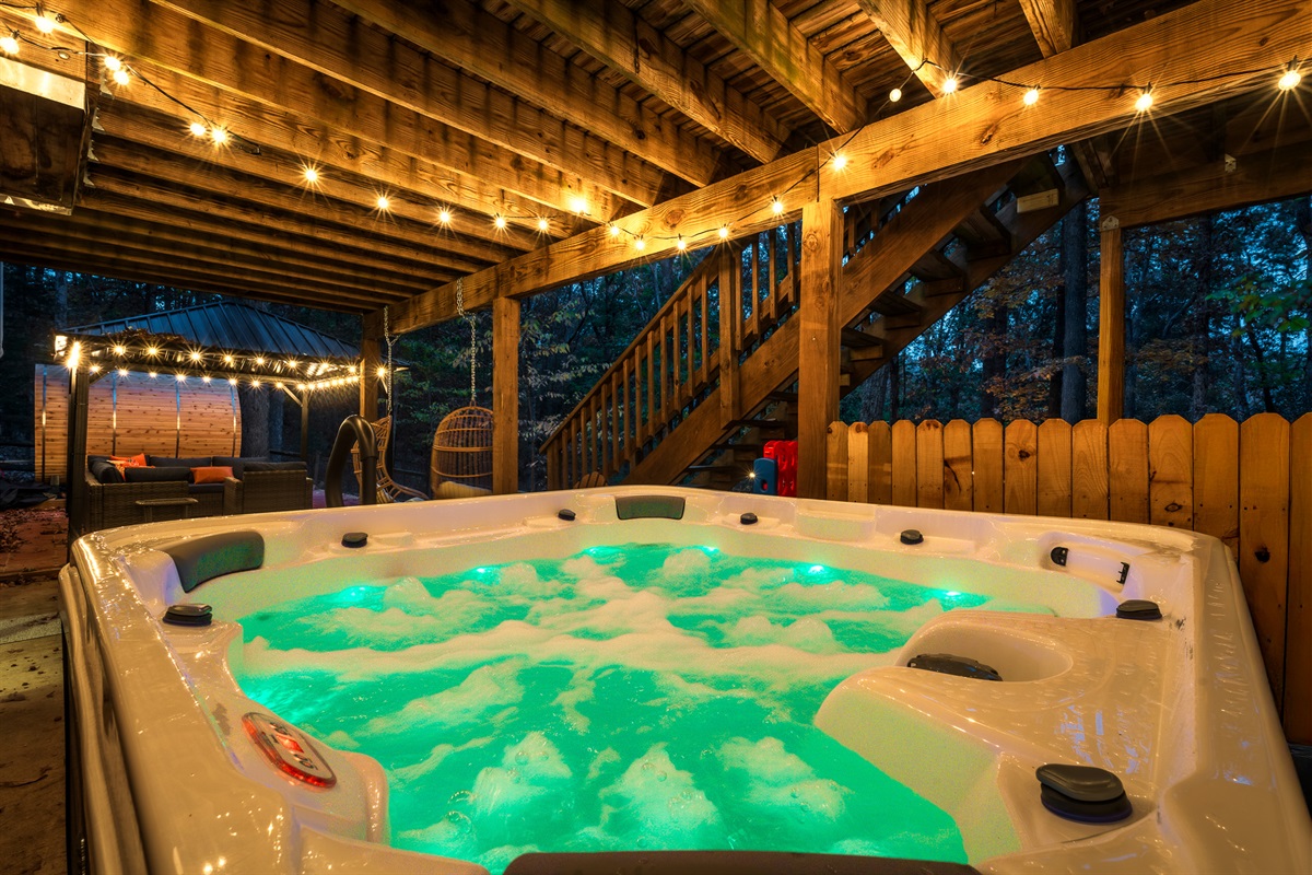 Evenings made better—soak under the string lights in our bubbling hot tub after a day of adventure