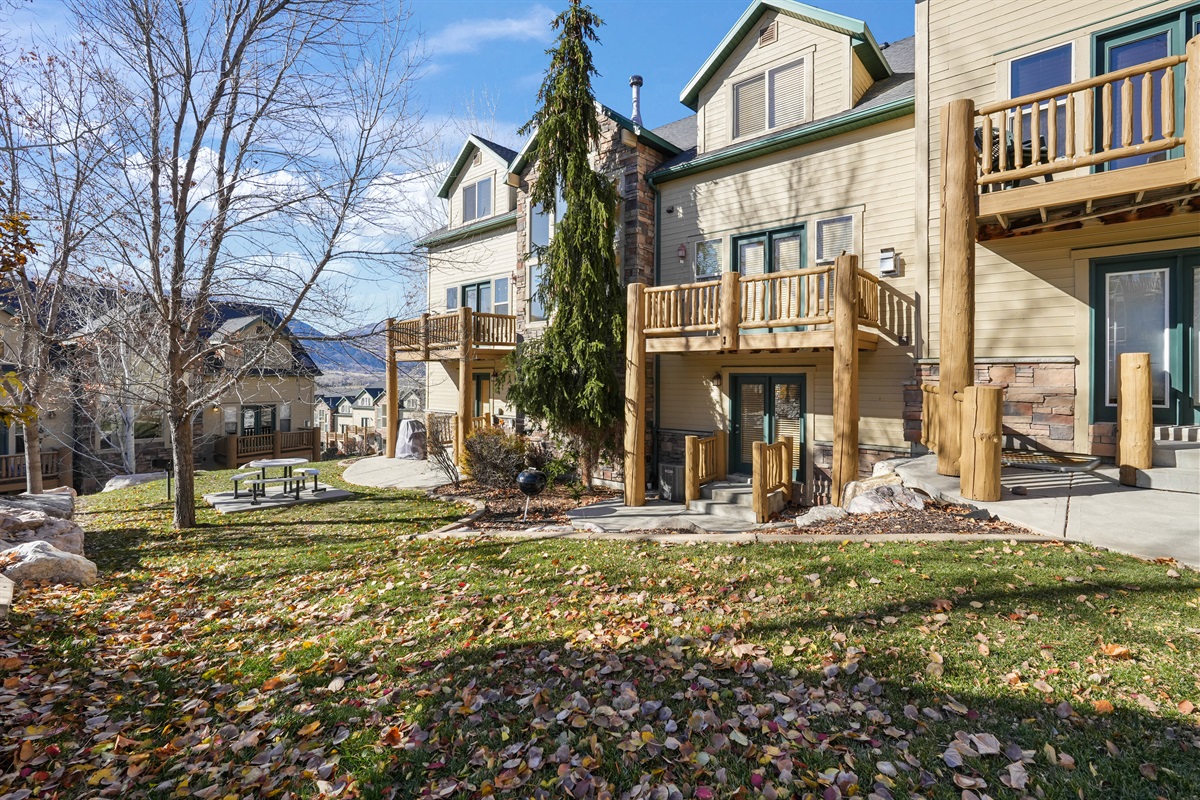 Charming exterior surrounded by trees and natural beauty—your peaceful home base.