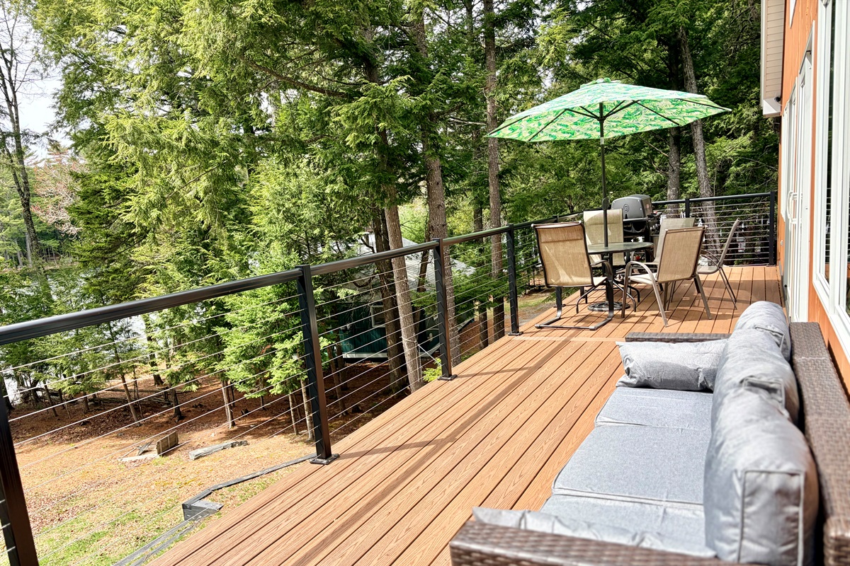 Deck with lake views, seating area, grill