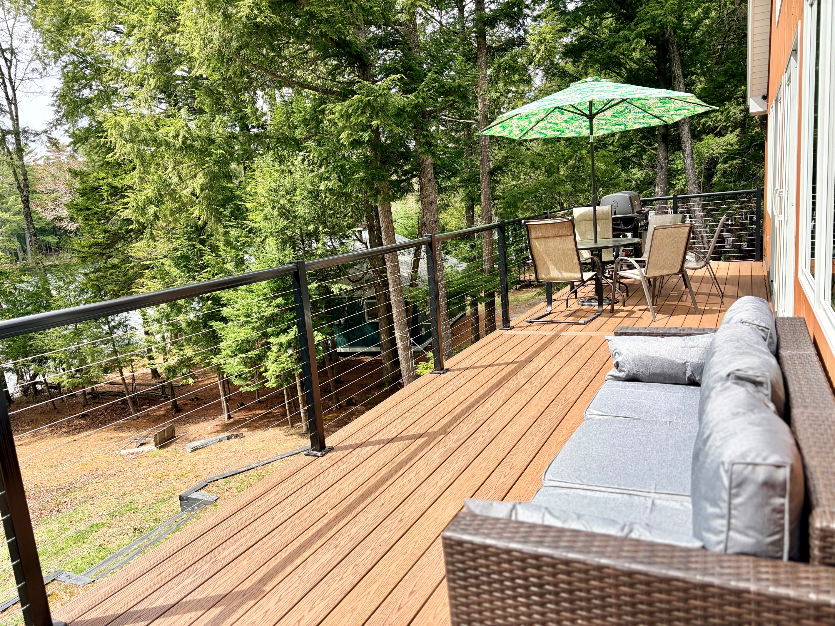 Deck with lake views, seating area, grill