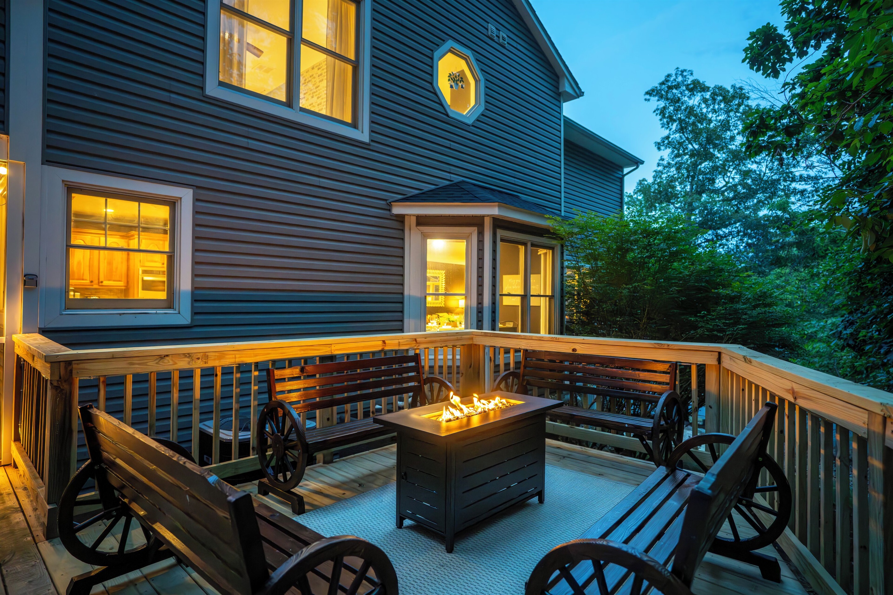 Deck with hot tub, sauna, and propane firetable / seating area
