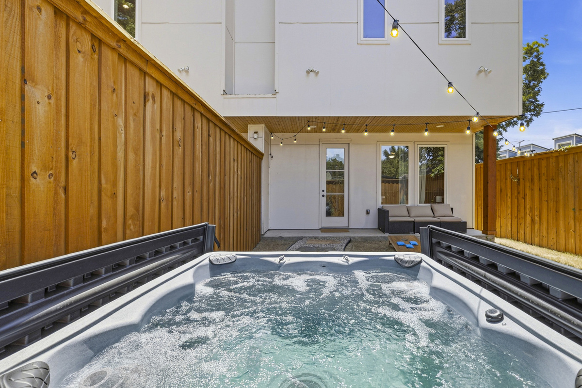 Unwind in your private hot tub under twinkling lights, perfect for relaxation!