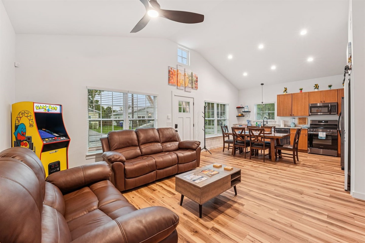 Comfortable reclining sofas, full-size Pacman arcade game (with Galaga and many other games) coffee table lifts up, board games in table.