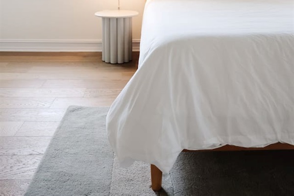 The spacious primary bedroom is a serene place to relax and recharge. The primary features a king sized bed, accents from CB2, walk-in closet, 50" Smart TV, and a full bath with a soaking tub and standup shower. 